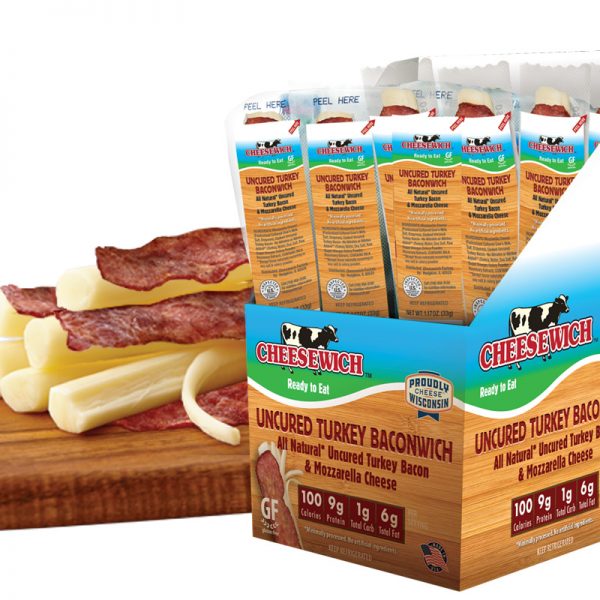 Mozzarella string cheese and All Natural Uncured Turkey Bacon in vacuum packed packaging with label. Product open and on cutting board.
